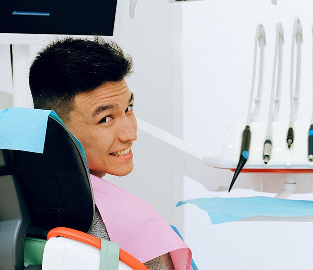 Smiling man in dentist’s chair