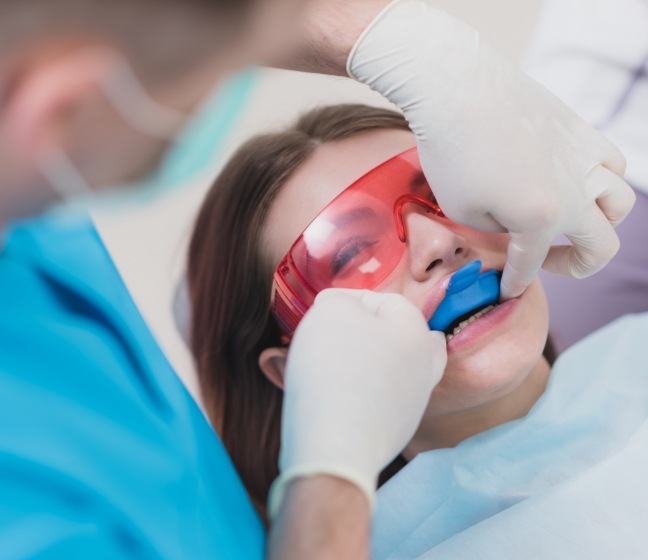 Dental patient receiving fluoride treatment