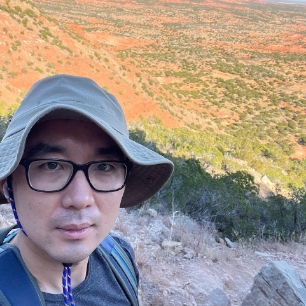 Doctor Lu enjoying the view on a hike