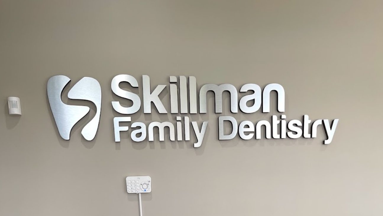 Skillman Family Dentistry sign on dental office wall