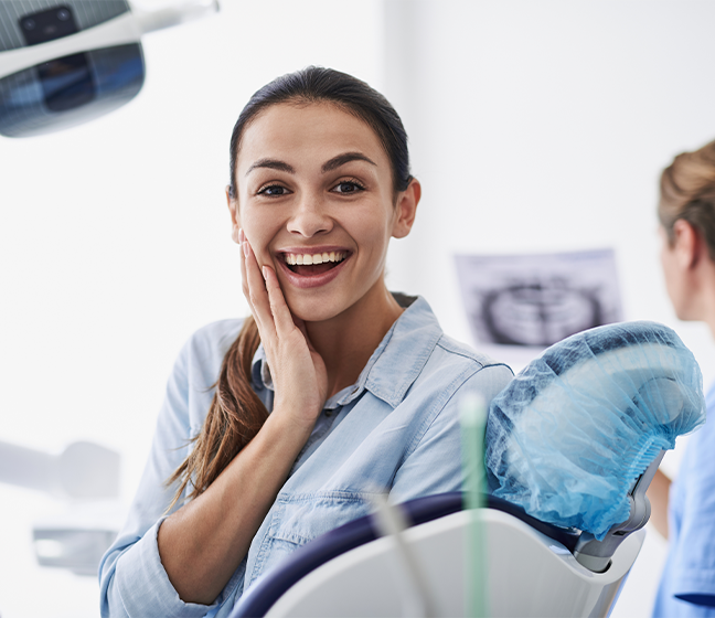 Woman smiling during dental offic visit