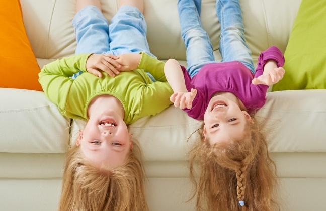 Two young dental patients with healthy smiles after children's dentistry visit