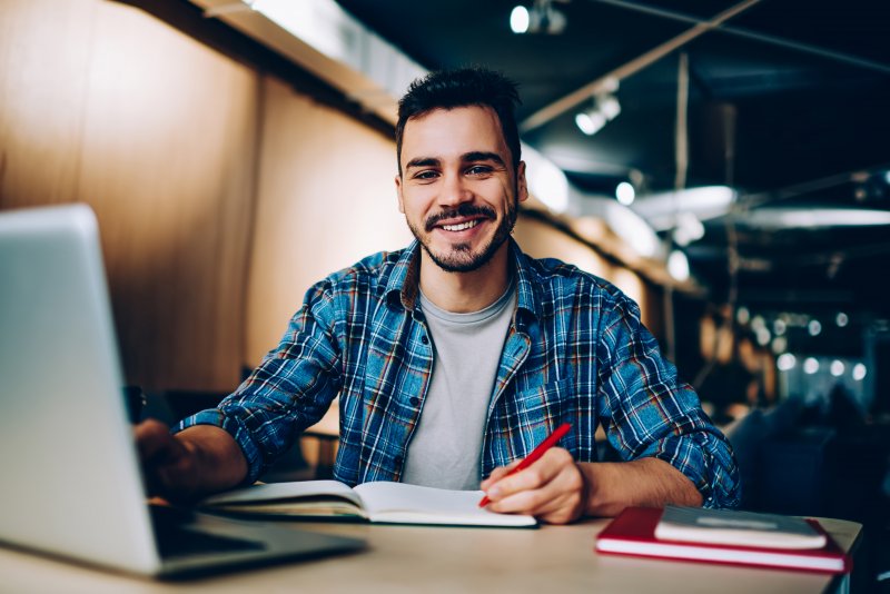 student smiling after a dental exam in Dallas