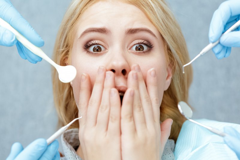 Woman afraid at the dentist