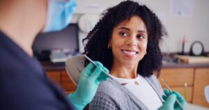 Woman smiling after her dental cleaning